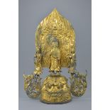 A large Chinese gilt bronze shrine of Buddha and two followers in four separate detachable pieces. 4