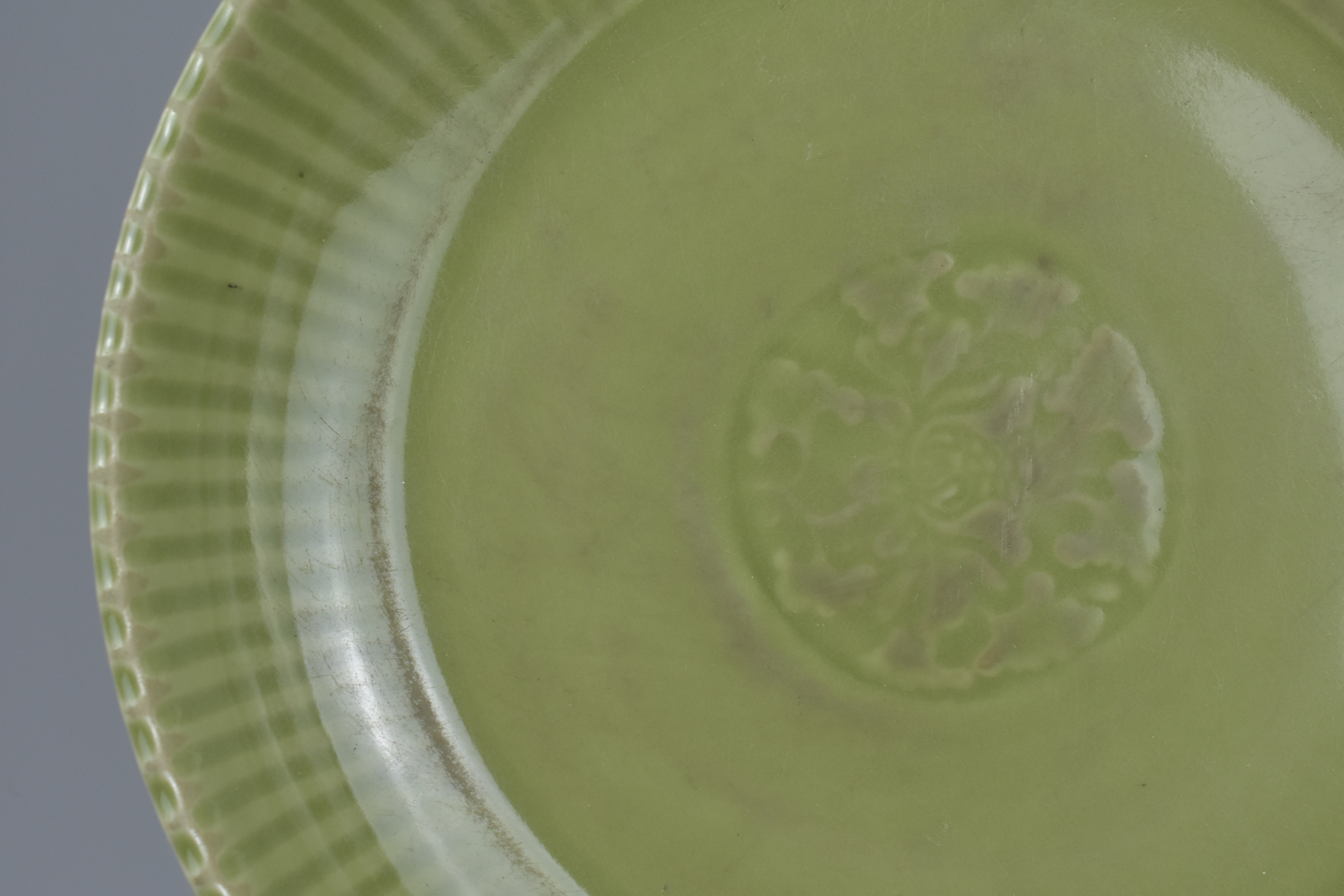 A large Chinese Ming dynasty or later celadon porcelain dish. 38cm diameter - Image 2 of 6