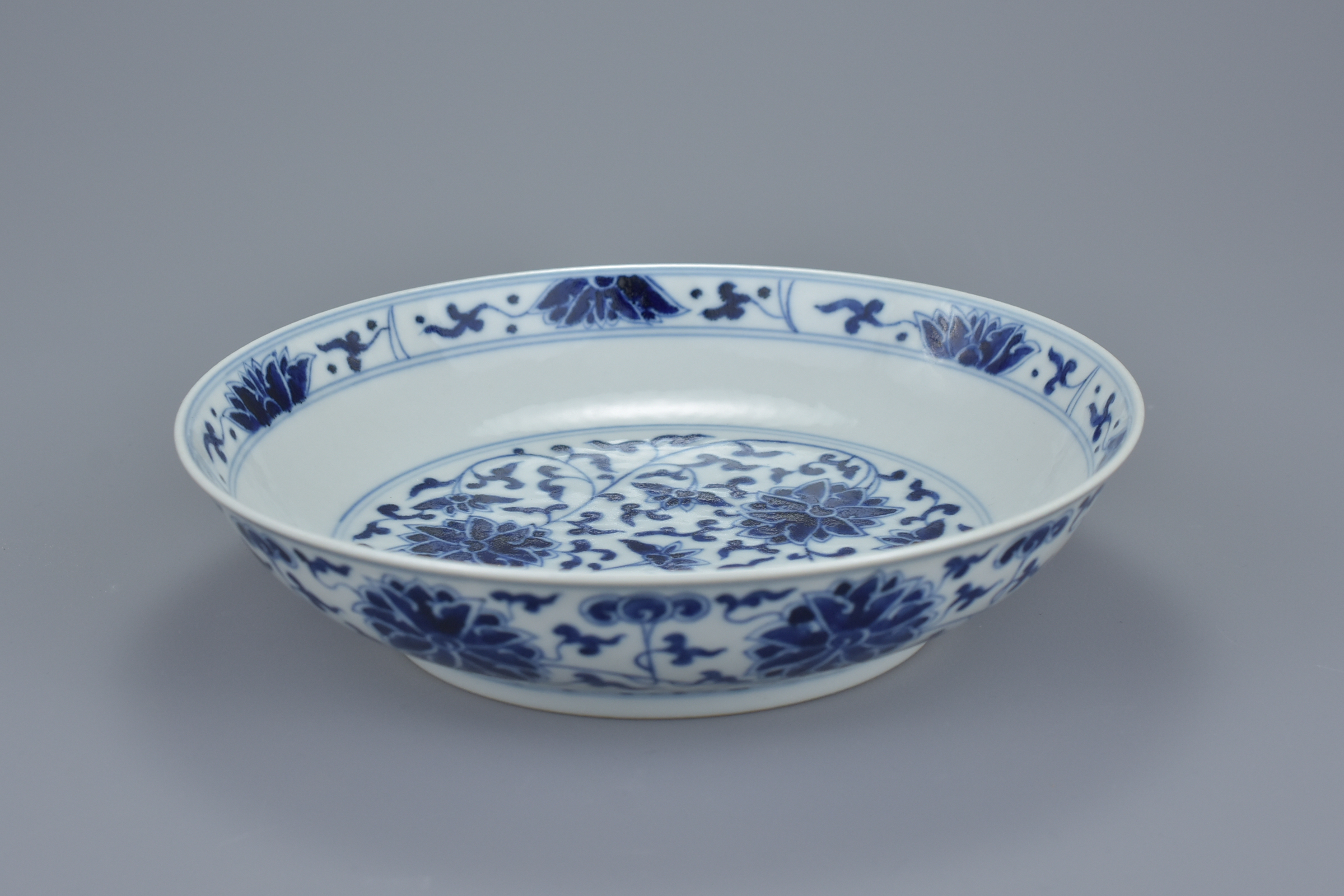 A Chinese late 19th century blue and white porcelain dish with floral lotus, chrysanthemum and peony - Image 6 of 6