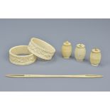 Pair of 19th century ivory napkin rings, together with four ivory sewing items. Napkins rings 5.5cm