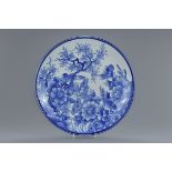 A very large 19th century Japanese blue and white porcelain dish with bird and floral decoration. 47