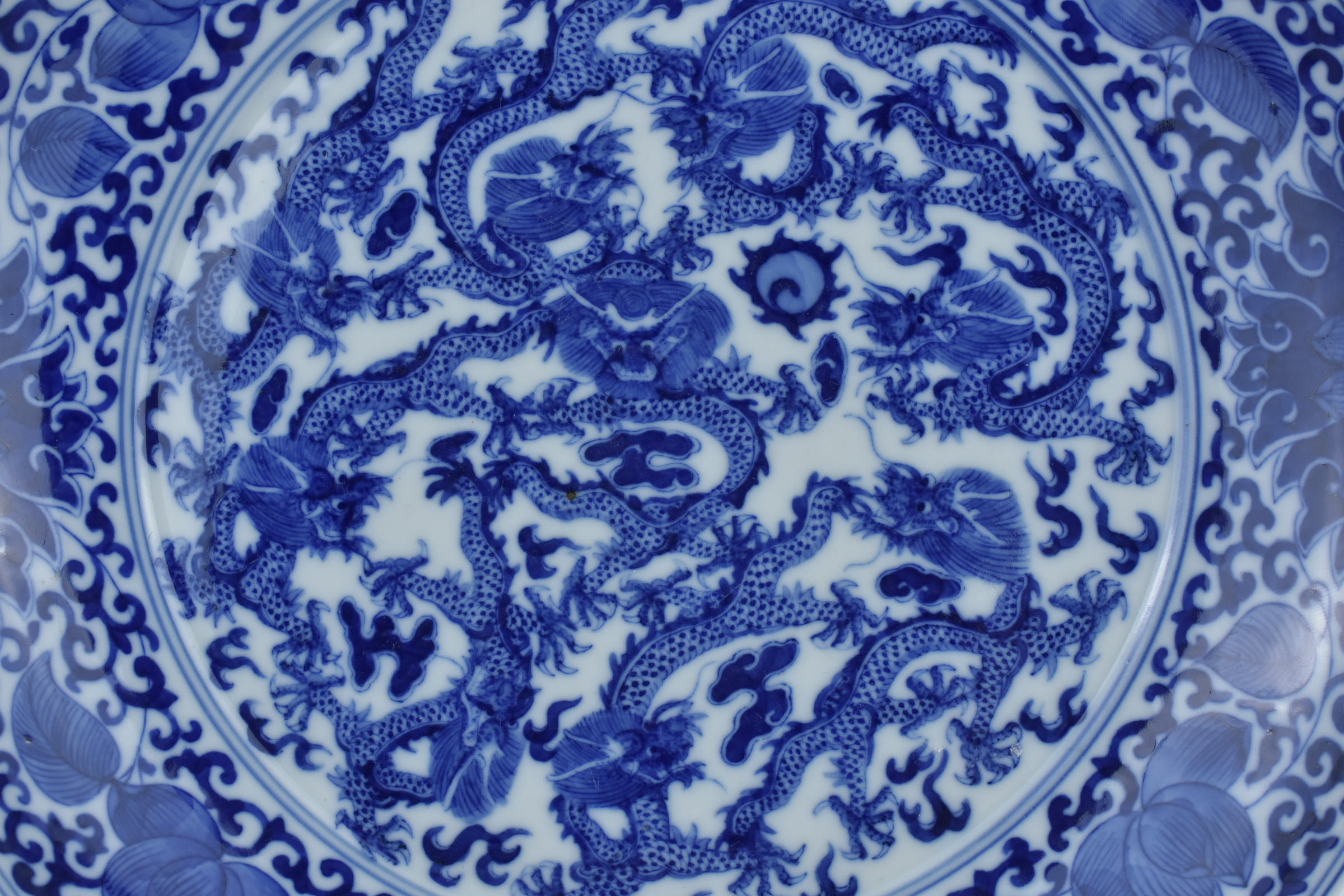 A Chinese late 19th century blue and white porcelain nine dragon dish. Mark and period of GuangXu (1 - Image 2 of 5