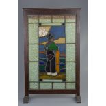 An English 19/20th century stained glass fire screen in wooden stand on two feet. 53cm x 86cm