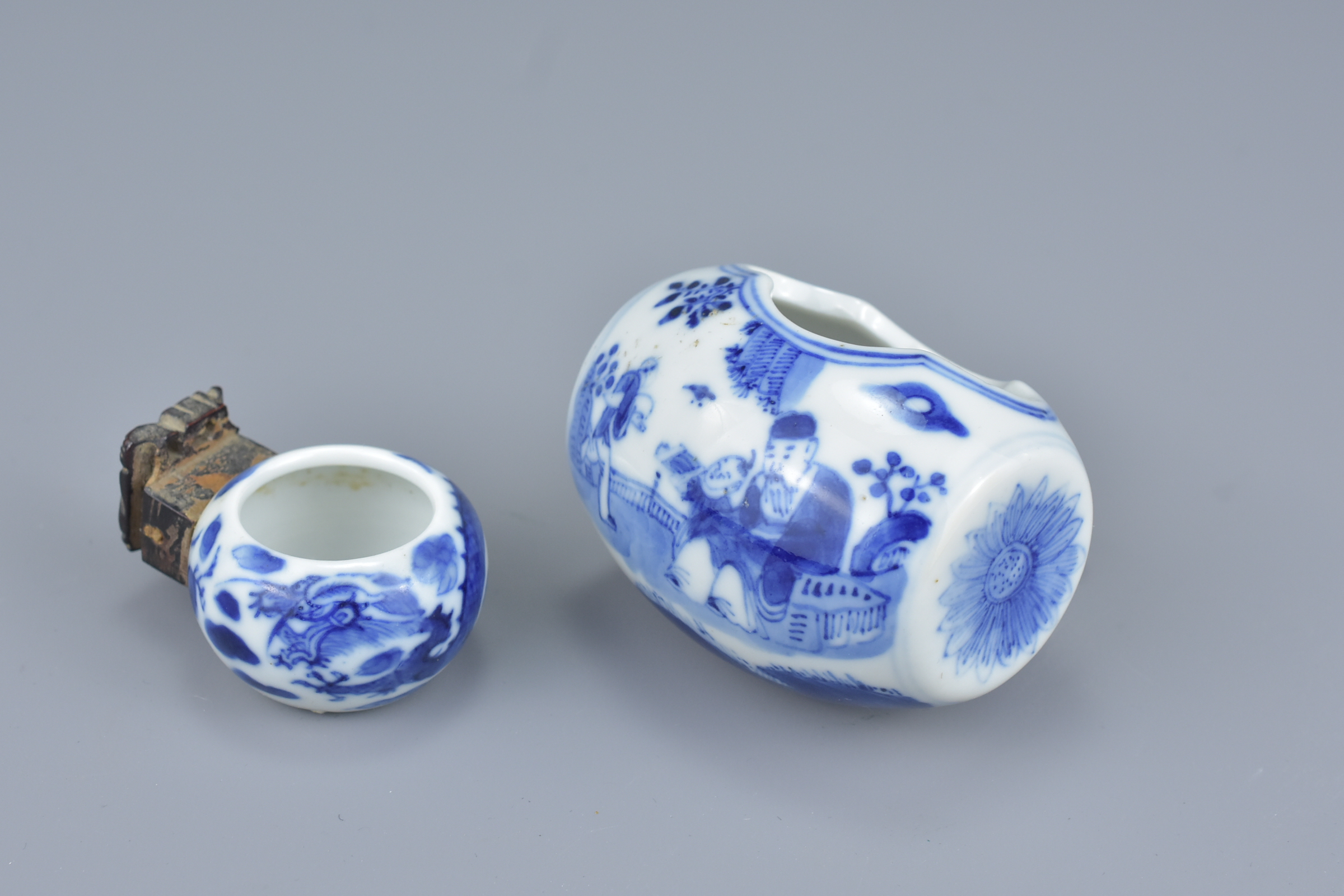 Two Chinese 19th Century blue and white porcelain bird feeders