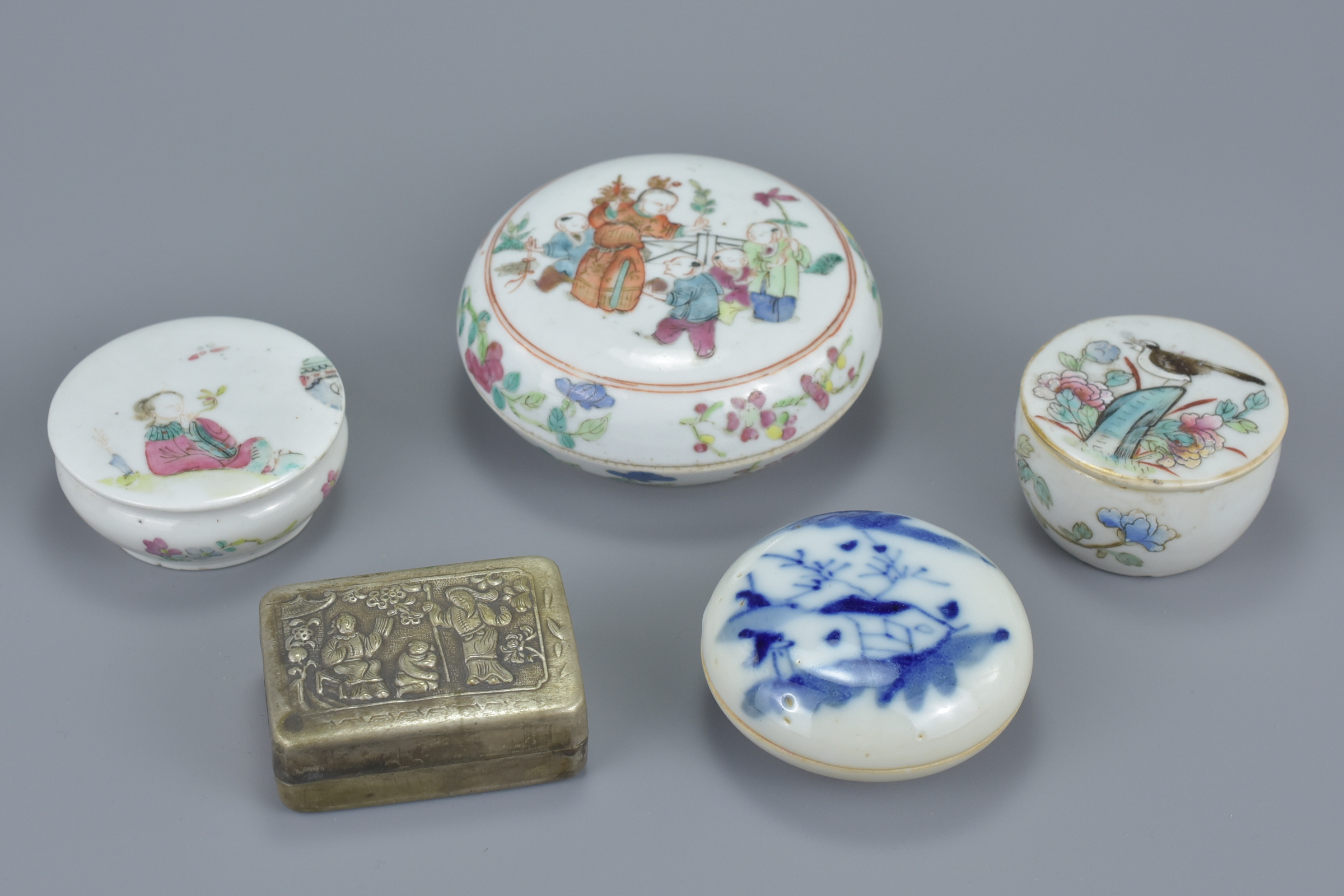 Three 19th century Chinese Famille Rose porcelain pots and covers together with a blue and white por