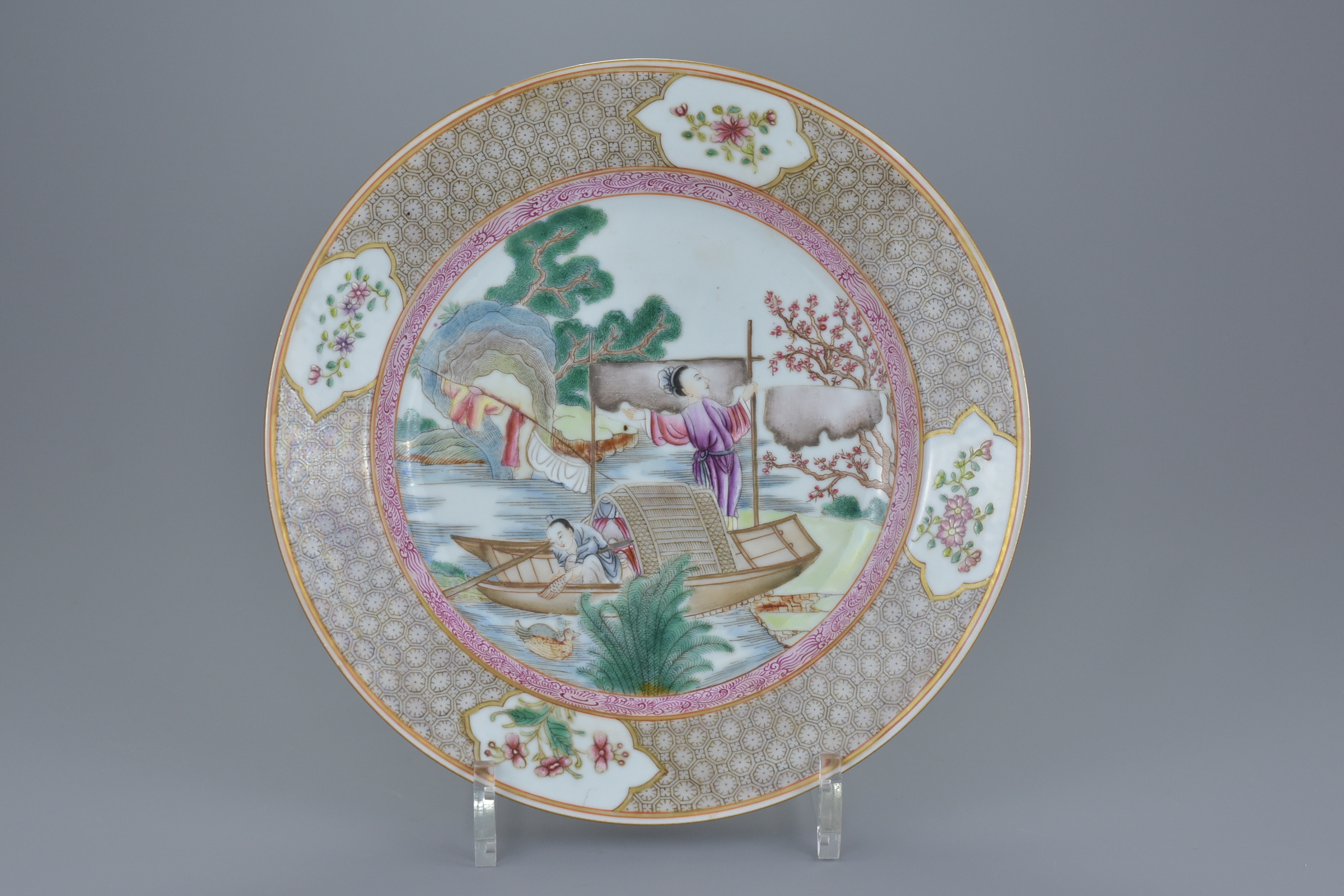 An 18th century Chinese Qianlong period Famille rose porcelain dish decorated with figures in a boat