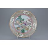 An 18th century Chinese Qianlong period Famille rose porcelain dish decorated with figures in a boat