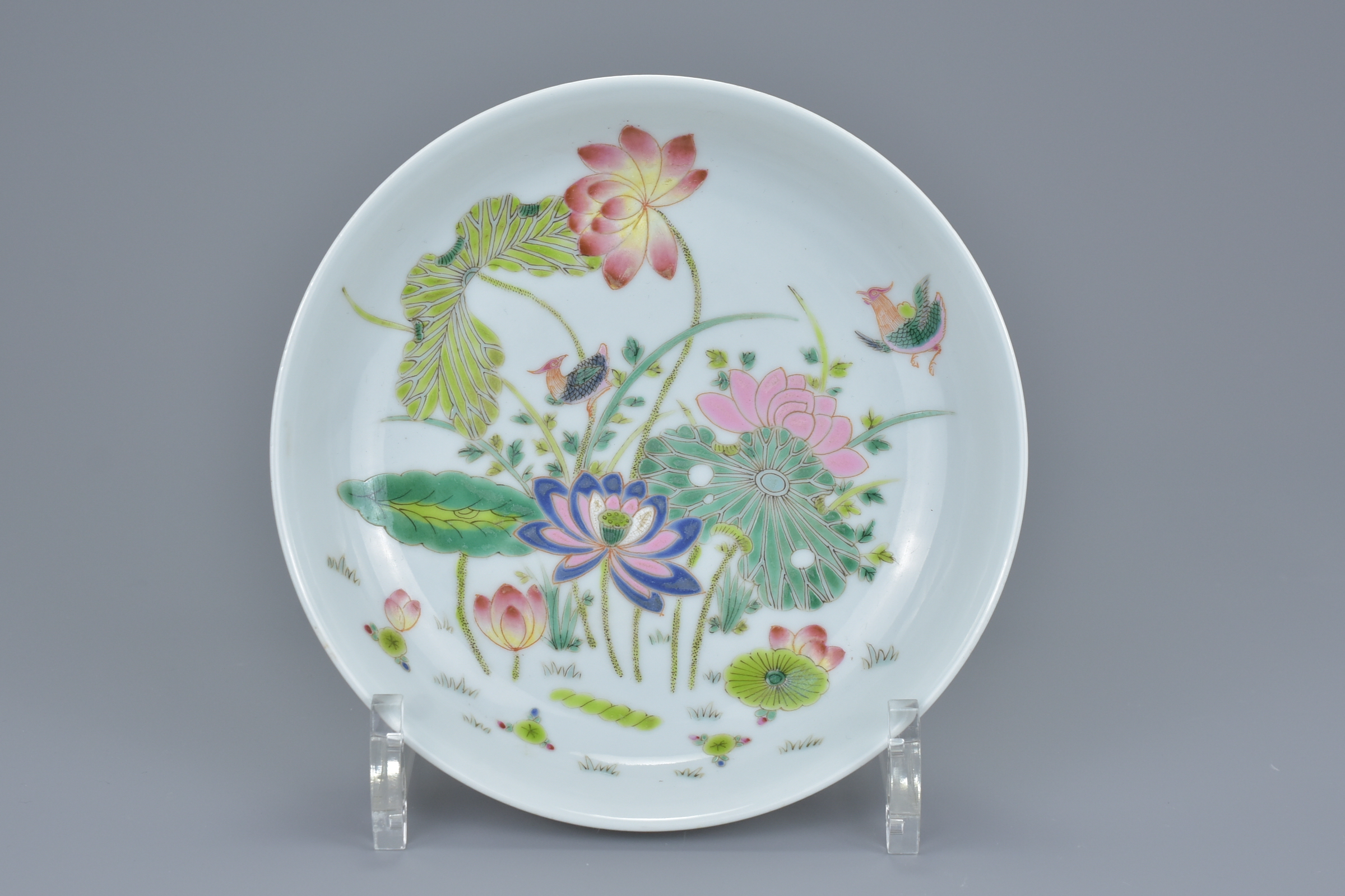 A Chinese 19/20th century Famille rose porcelain dish with florals and bird design. Six-character ma