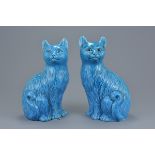 A pair of Chinese turquoise glazed porcelain figures or seated cats. Overall good condition. 21Cm ta