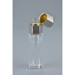 A French early 20th century glass perfume bottle with silver cap and original glass stopper. Makers