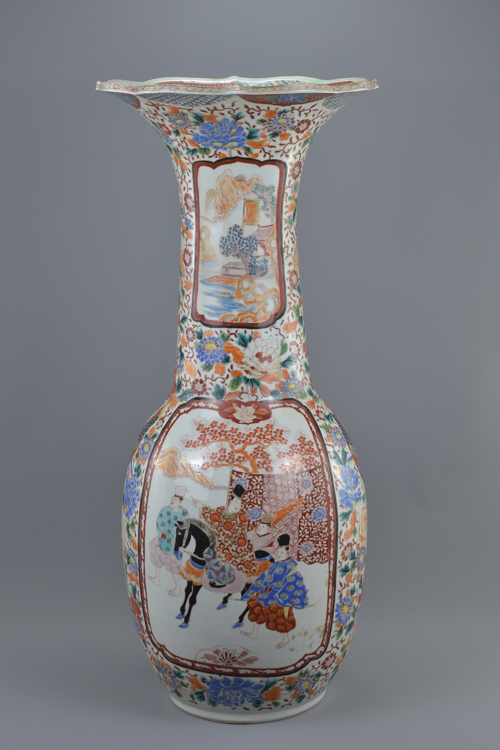 A very large 19th century Japanese Imari fluted porcelain vase decorated panels of birds and figure.