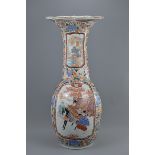 A very large 19th century Japanese Imari fluted porcelain vase decorated panels of birds and figure.