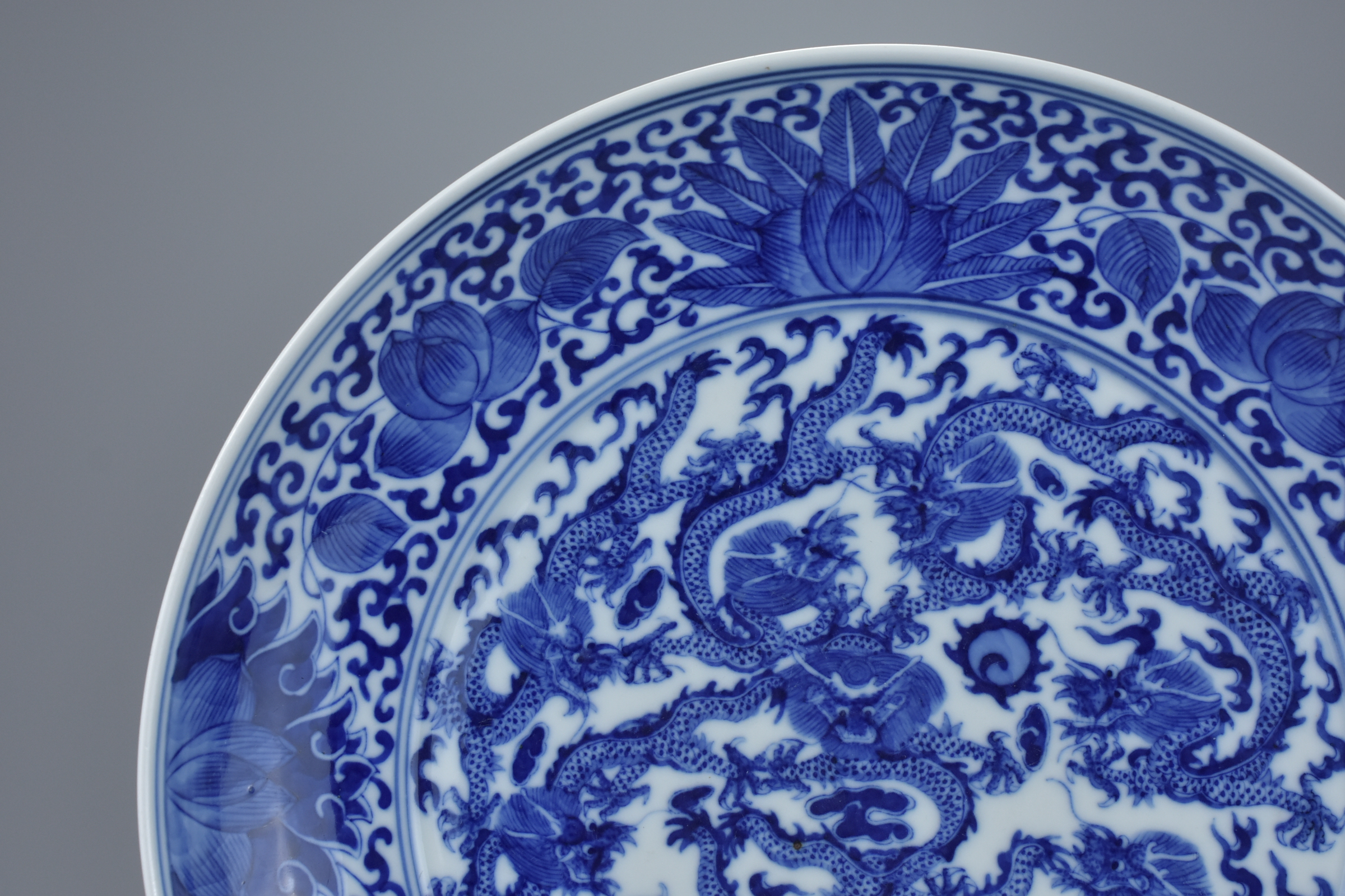 A Chinese late 19th century blue and white porcelain nine dragon dish. Mark and period of GuangXu (1 - Image 3 of 5