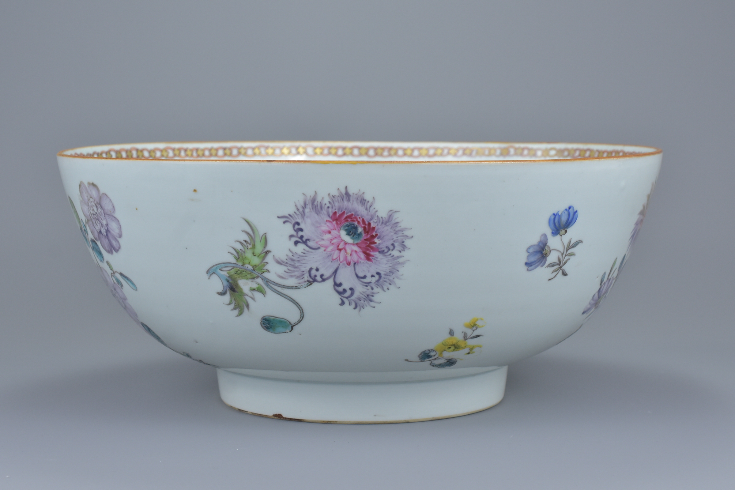 A large Chinese 18th century famille rose porcelain punch bowl decorated with various flowers and br - Image 2 of 8