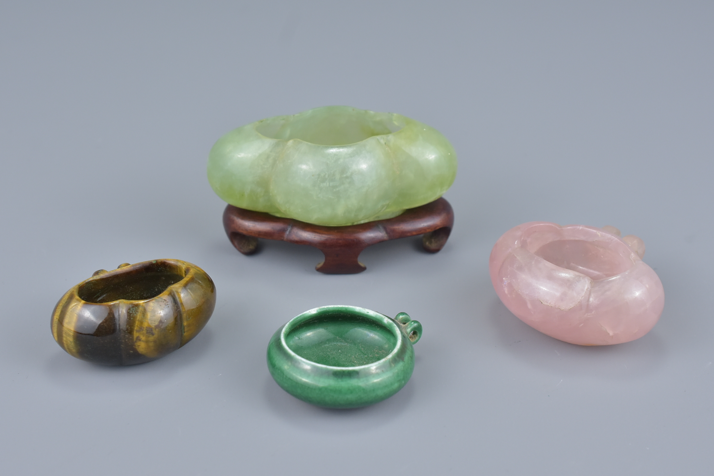 A group of three Chinese 19/20th Century bird feeders and pot