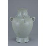 A Chinese 18th century Guan Yao type archaic style porcelain vase with Twin Loop Handles bearing cha