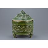 A Chinese Han dynasty (206 BC - 220 AD) green glazed pottery Hill jar and cover on three bear suppor