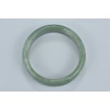 A Chinese jade bangle. Interior diameter 7cm