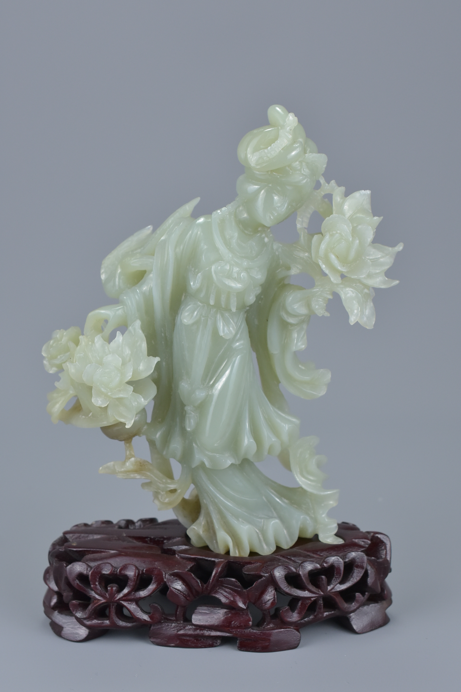 A Chinese jade figure of a Goddess holding flowers on a carved wooden stand together with a small re - Image 2 of 5