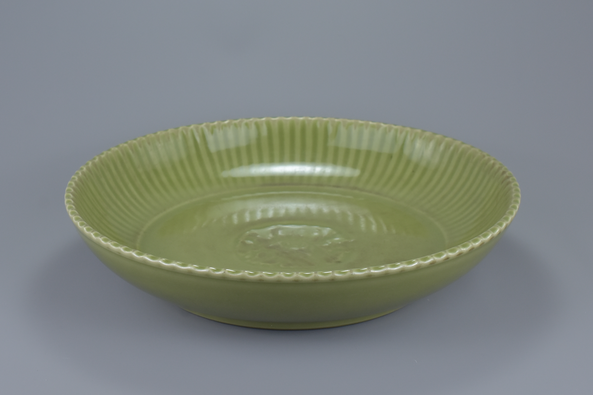 A large Chinese Ming dynasty or later celadon porcelain dish. 38cm diameter - Image 6 of 6