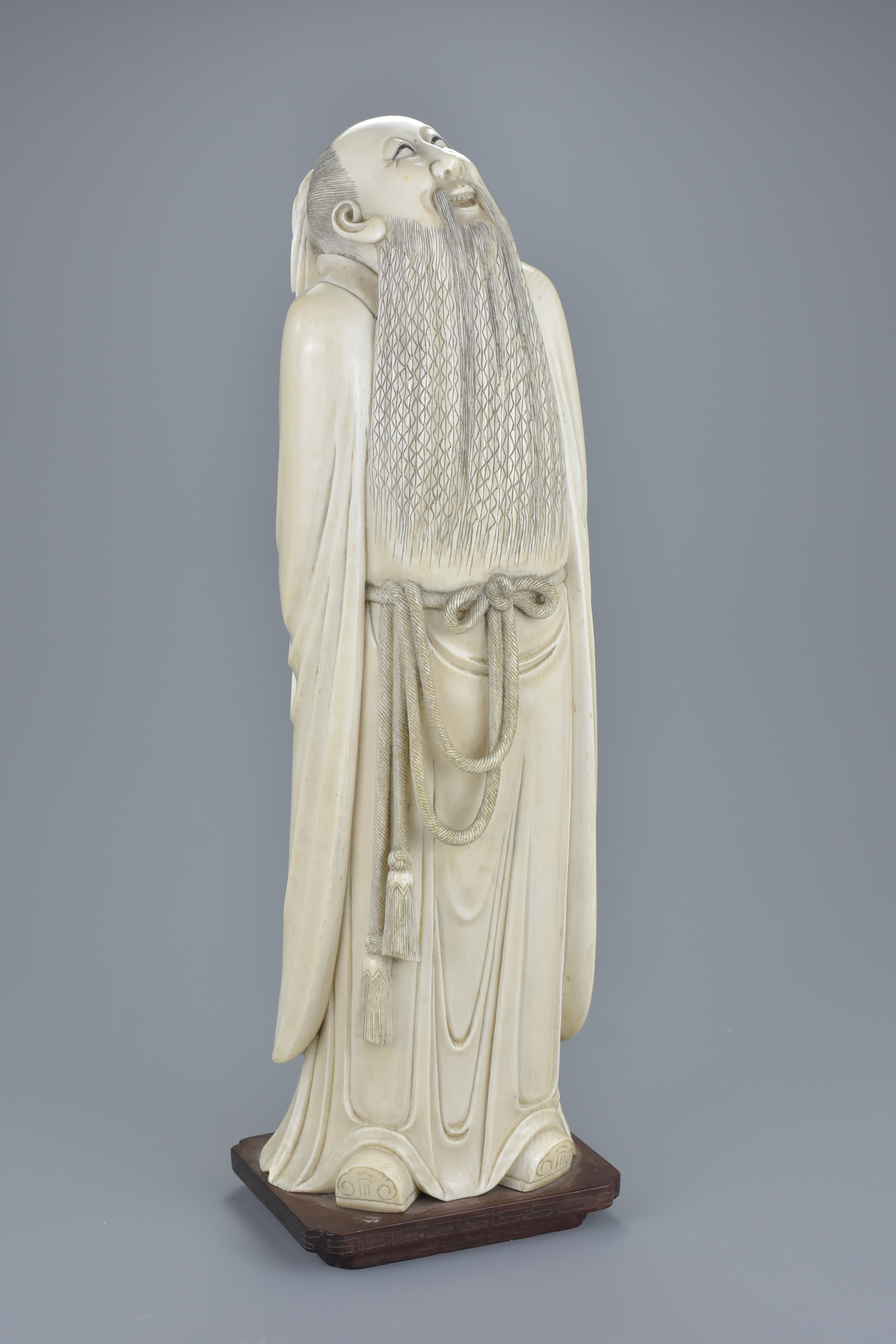 A superb quality Chinese 19th century carved ivory figure of poet Li Bai gazing at the moon with his