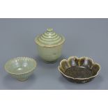 Three Chinese Song dynasty pottery items. To include a celadon chrysanthemum bowl, a straw glazed lo