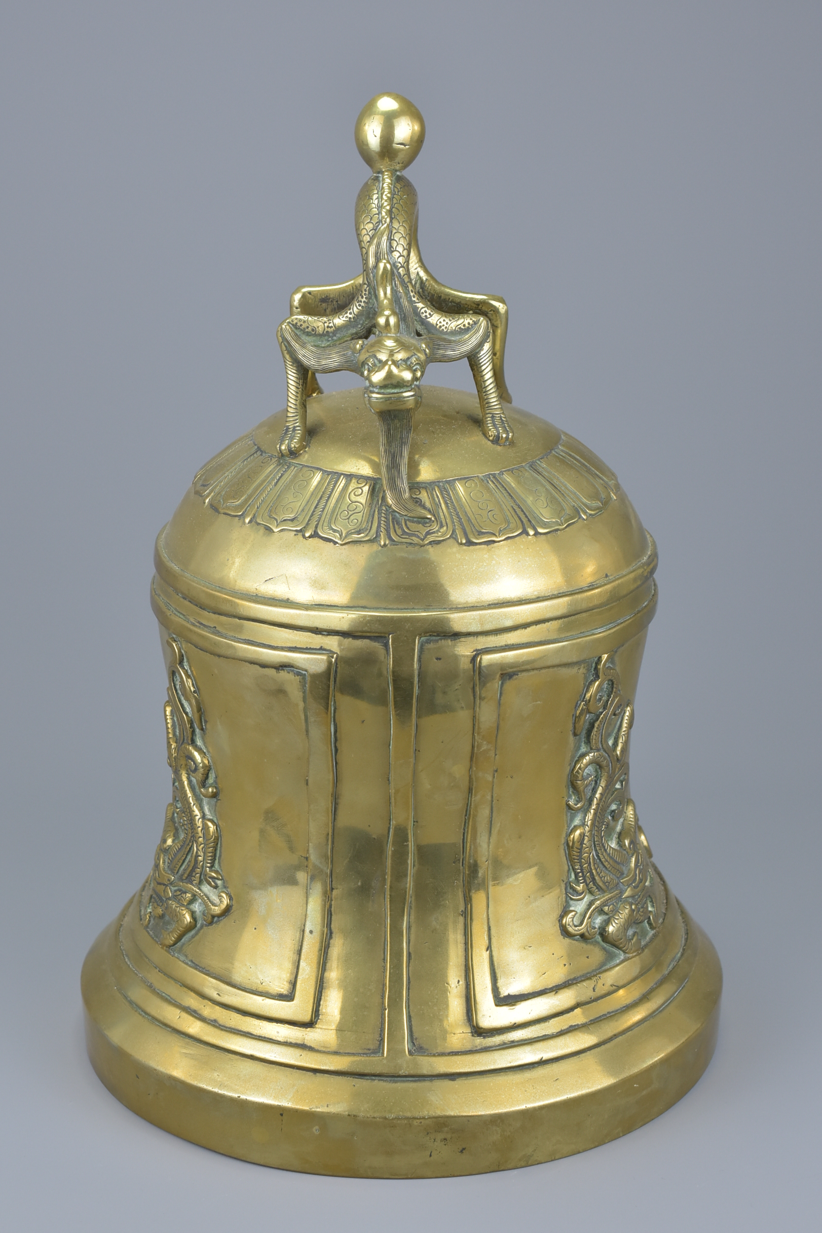 A large Chinese polished bronze bell gong mounted with a dragon handle. 33Cm tall - Image 2 of 6