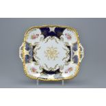 A single Coalport blue ground and gilt square porcelain serving dish with handles and floral decorat