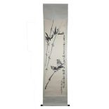A large Chinese ink painting on paper in scroll with wooden handles of birds and bamboo with three r