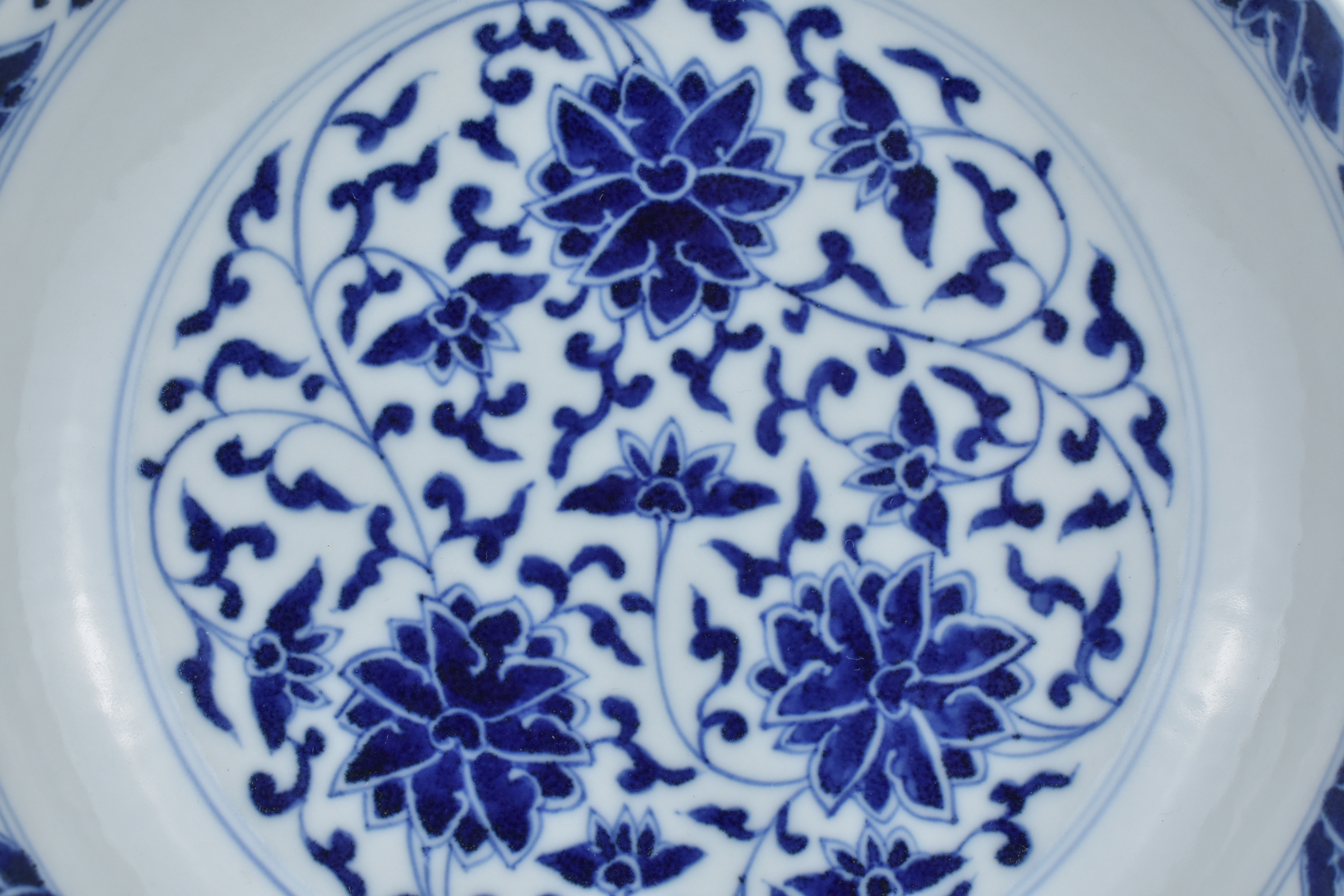A Chinese late 19th century blue and white porcelain dish with floral lotus, chrysanthemum and peony - Image 2 of 6