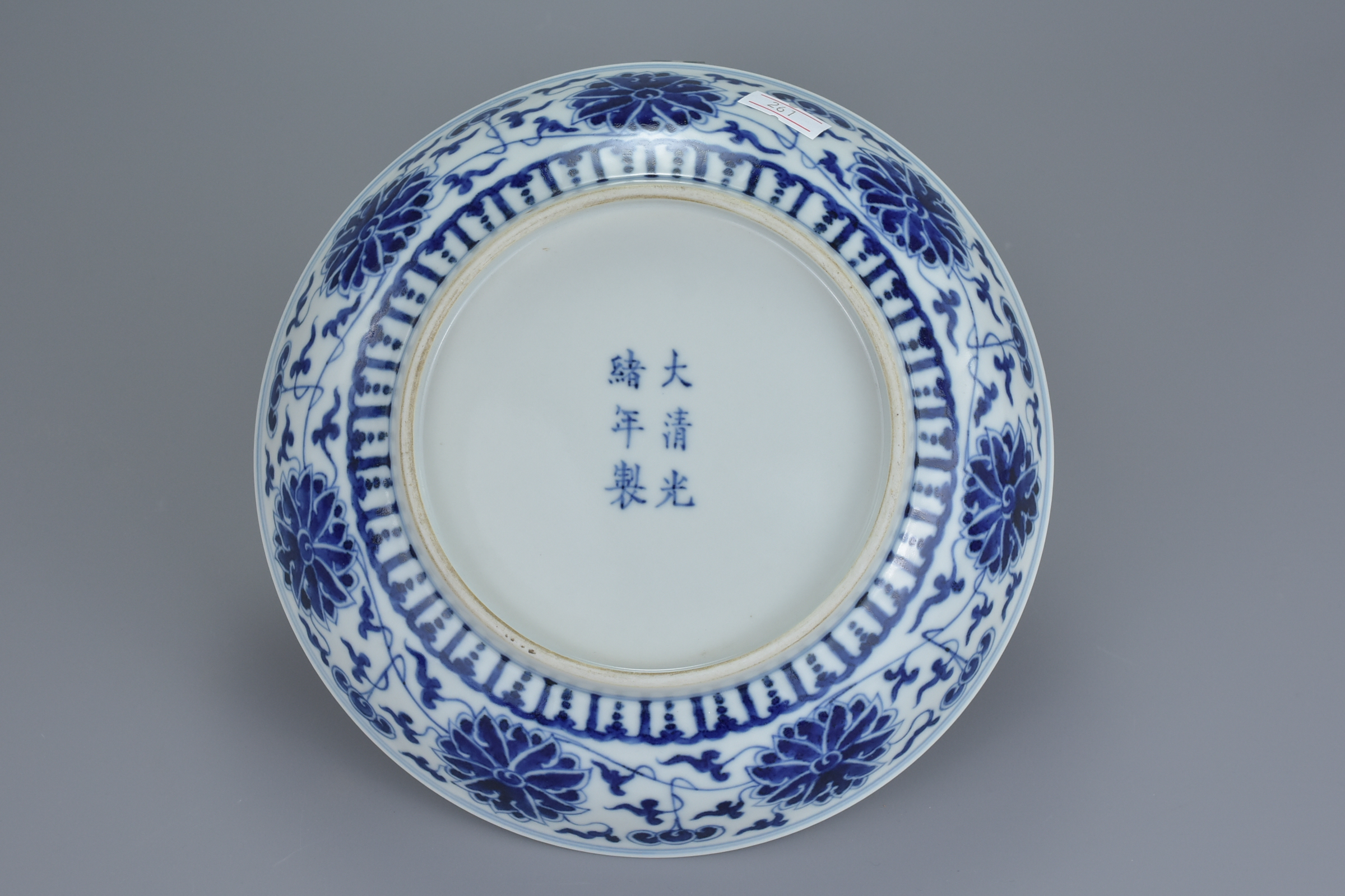 A Chinese late 19th century blue and white porcelain dish with floral lotus, chrysanthemum and peony - Image 4 of 6