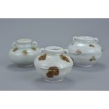 Three Chinese Yuan dynasty white glazed porcelain jars decorated with brown spots with twin looped h