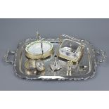 A large white metal twin handled serving tray together with a silver plated and porcelain butter dis