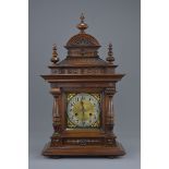 A Victorian oak cased two train mantle clock in working order with pendulum. No key. 33cm x 59cm