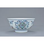 A Chinese 18/19th century daocai porcelain bowl decorated with floral patterns. Six-character mark o