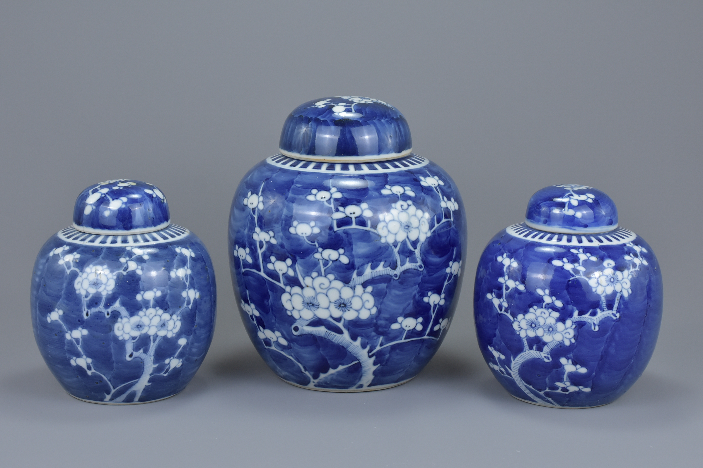 Three Chinese 19th century blue and white porcelain prunus ginger jars with covers. 16Cm to 21cm tal