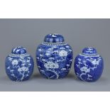 Three Chinese 19th century blue and white porcelain prunus ginger jars with covers. 16Cm to 21cm tal