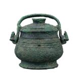 A RARE BRONZE RITUAL WINE VESSEL AND COVER, YOU. WESTERN ZHOU PERIOD