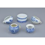 A group of five Chinese 19th Century blue and white porcelain bird feeders
