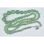 A Graduated Pale Celadon Jade Bead Necklace