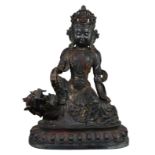 A Large Tibetan Bronze Figure of a Seated Buddha on a Mythical Beast