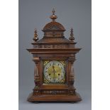 A Victorian Oak Cased Two Train Mantle Clock, With Pendulum and Key