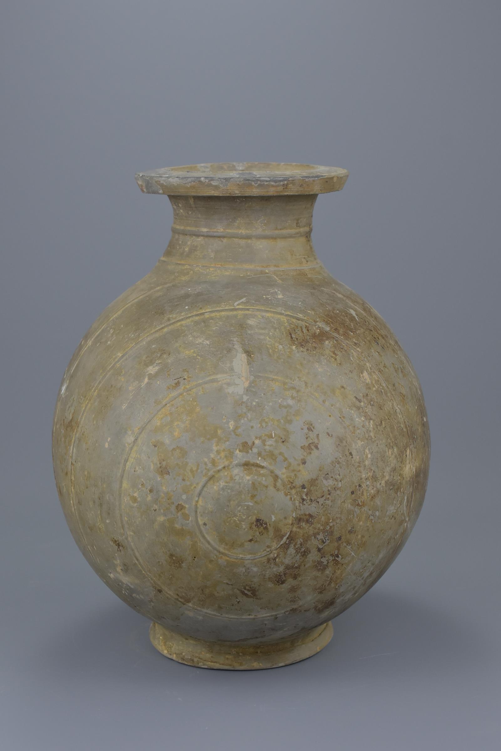 A Chinese Qin / Early Western Han Dynasty Burnished Pottery Cocoon Jar - Image 3 of 8