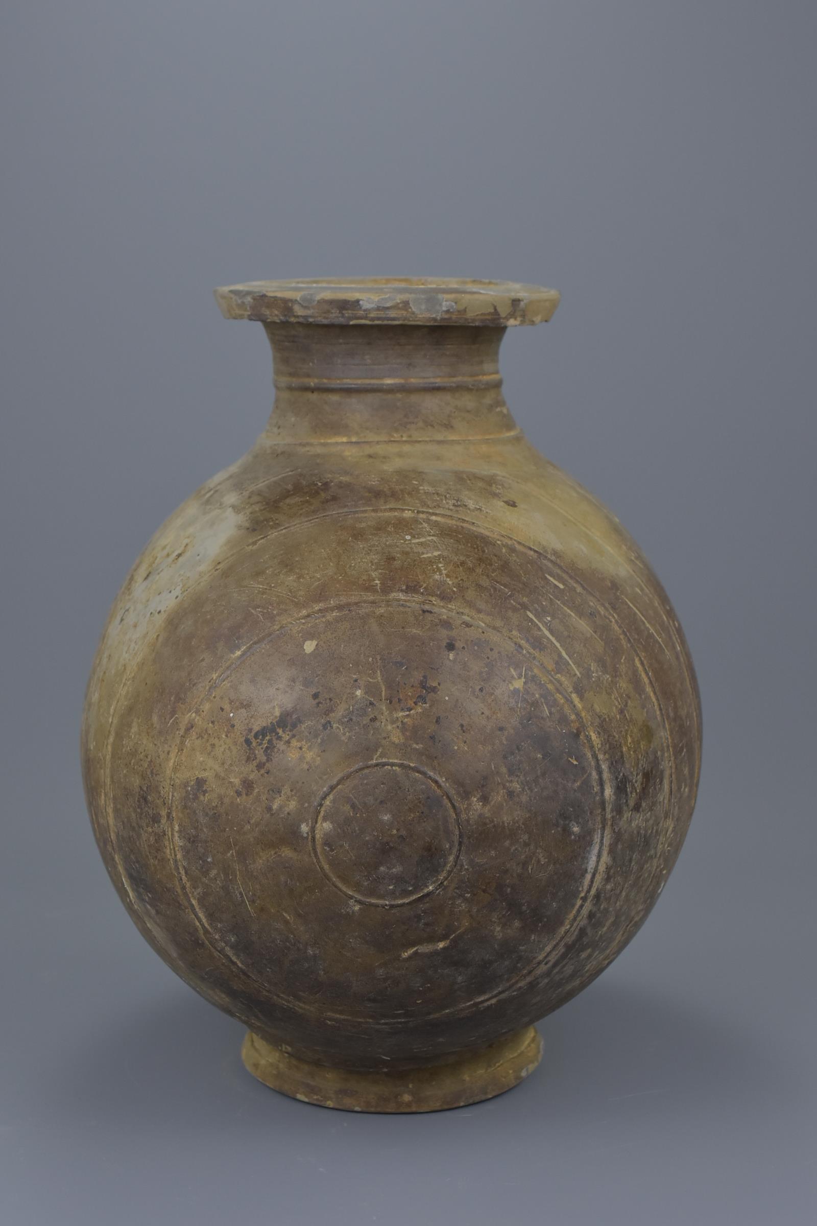 A Chinese Qin / Early Western Han Dynasty Burnished Pottery Cocoon Jar - Image 5 of 8