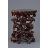 A Chinese 20th C. carved hardwood root-form display stand