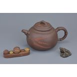 A Chinese Yixing pottery teapot