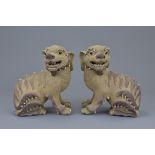 A pair of Chinese 19/20th C. Shiwan pottery dogs
