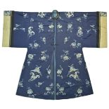 A Chinese late 19th C. Qing Dynasty blue ground silk embroidered surcoat