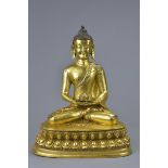 A 20th C. Tibetan gilt bronze figure of buddha Sakyamuni