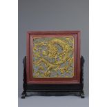 A Chinese carved wood dragon screen and base